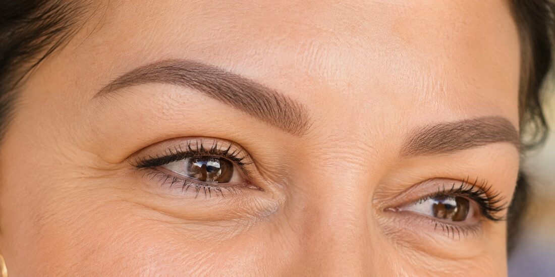 Healed powder brows close-up — soft, dimensional, natural — Kiss Kreations Tempe AZ
